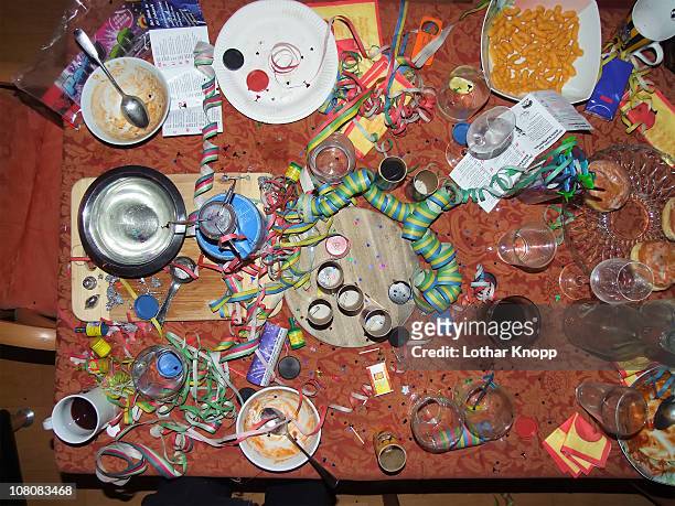 chaos on table top after new years eve party - messy table stock pictures, royalty-free photos & images