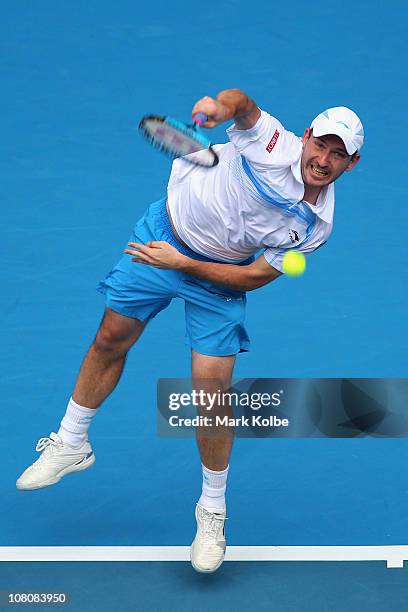 Jan Hajek of the Czech Republic serves in his first round match against Andy Roddick of the United States of America during day one of the 2011...