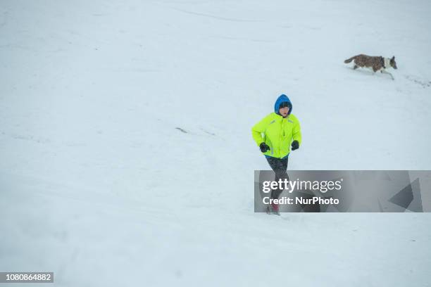 Person runs through the snow. Many persons used the snow and the cold weather to sled. There were even people who skied or snowboarded. On 11 January...