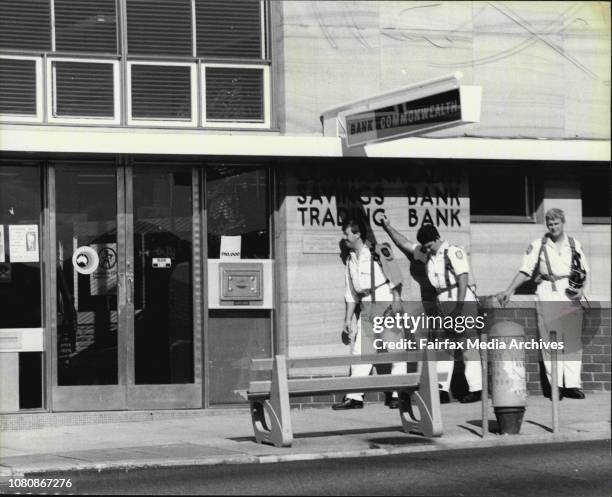 Police enters the Commonwealth Bank at Coogee Beach to assess the result of a shotgun charge into a mystery package found outside the building today....