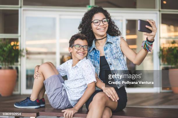 sibling selfie - teen sibling stock pictures, royalty-free photos & images