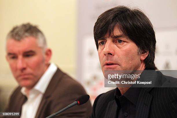 Head coach Mirko Slomka of Hannover and national coach Joachim Loew of Germany attend the press conference at Kempinski-Hotel Gravenbruch on January...