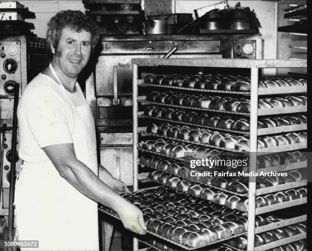 Mr. Pat Curry a baker from the Dobinsons Bakery at Rose Bay shows the Sun some of the Fresh Hot Cross Bun that he has been baking this morning. April...