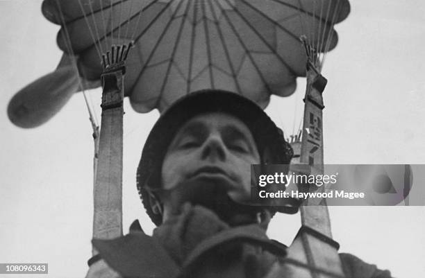 British paratrooper takes a photograph of himself in mid air during World War II, 1944. Original Publication : Picture Post - 1599 - Paratroops -...
