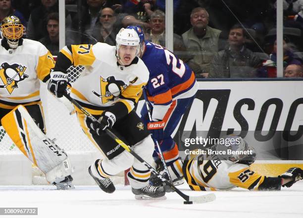 Evgeni Malkin of the Pittsburgh Penguins skates against the New York Islanders at NYCB Live at the Nassau Coliseum on December 10, 2018 in Uniondale,...