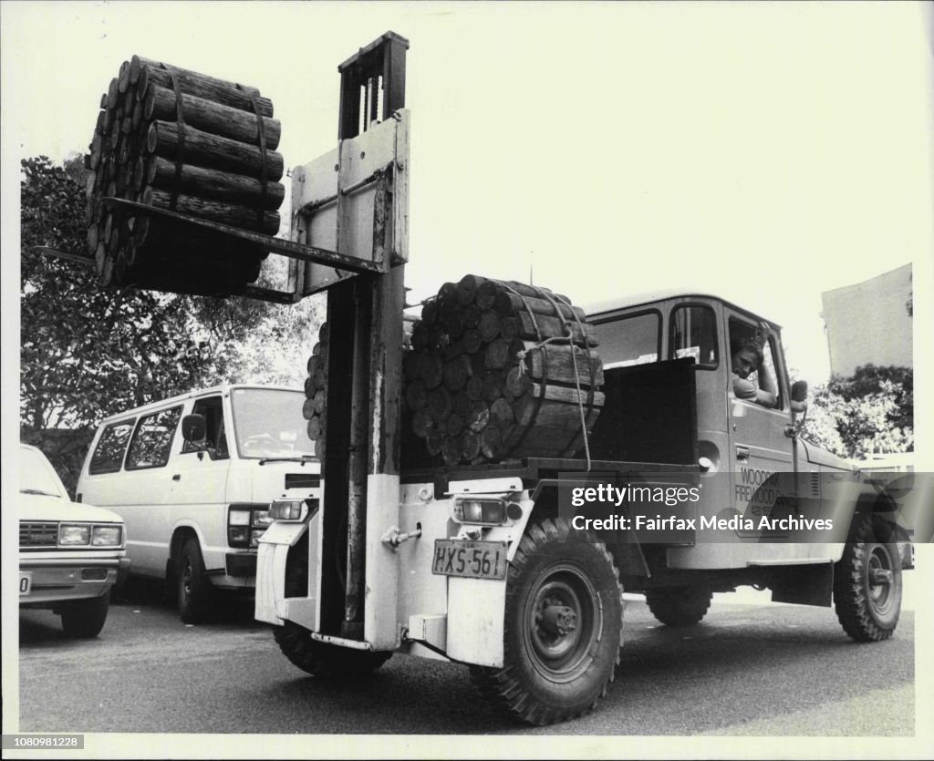 Alan Wheen and Colin Burn with their Woodpak Certon containing 18 inch (45cm) hardwood logs packed at their Wingham Plant.Woodpak firewood pack is forklifted from 4WD All-Terrain fork life.Wood for dorsch fires.