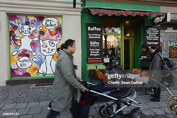 Young families stroll in Raumerstrasse in Prenzlauer Berg district on January 17, 2011 in Berlin, Germany. Gentrification in East Berlin districts...