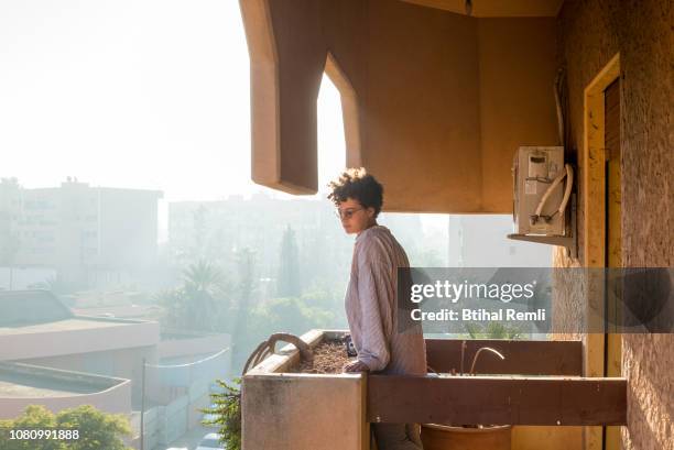 young woman having morning coffee - marokko marrakesh stock-fotos und bilder