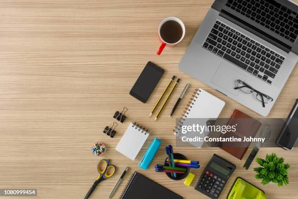 top view of laptop, notebook, coffee and office supply items on wood background - arrumado imagens e fotografias de stock