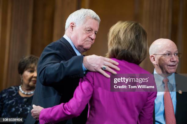 Rep. Collin Peterson, D-Minn., chairman of the House Agriculture Committee, and Speaker Nancy Pelosi, D-Calif., talk before a group photo in the...