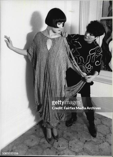 Fashion designer Vivian Chan Shaw and her daughter Claudia, Vivian adjusts dresses modeled by her daughter. August 04, 1986. .
