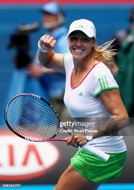 Alicia Molik of Australia celebrates winning her first round match against Roberta Vinci of Italy during day two of the 2011 Australian Open at...