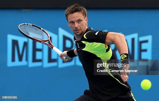 Robin Soderling of Sweden plays a forehand in his first round match against Potito Starace of Italy during day two of the 2011 Australian Open at...