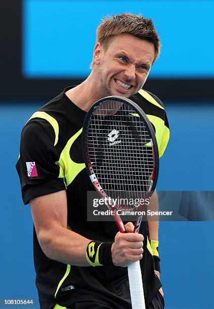 Robin Soderling of Sweden celebrates match point in his first round match against Potito Starace of Italy during day two of the 2011 Australian Open...
