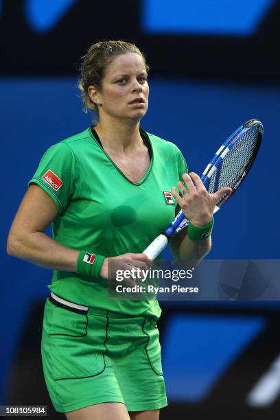 Kim Clijsters of Belgium reacts after winning her first round match against Dinara Safina of Russia during day two of the 2011 Australian Open at...