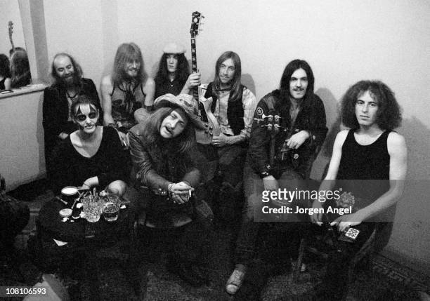 Hawkwind posed backstage in Bristol, England in April 1972 L-R Del Dettmar, Nik Turner, Simon King, Dave Brock, Lemmy, ?, Front: Stacia Dik Mik