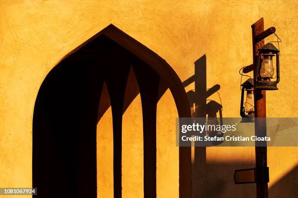 lamp inside of nizwa fort, oman - oman muscat stock pictures, royalty-free photos & images