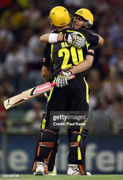 Shaun Marsh and Marcus North of the Warriors celebrate winning the Twenty20 Big Bash match between the Western Australia Warriors and the Victorian...