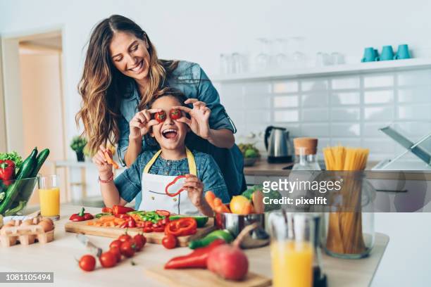 happy time in the kitchen - family with one child stock pictures, royalty-free photos & images