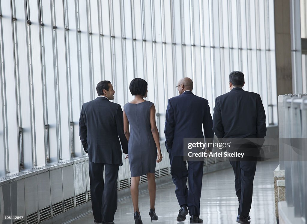 Business people walking in corridor