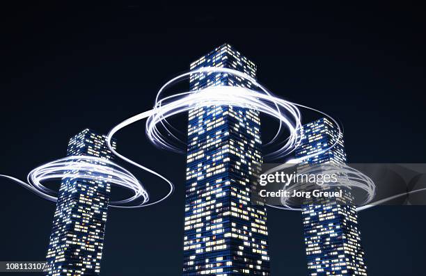 light trails around high-rise buildings - home inspiration stock illustrations