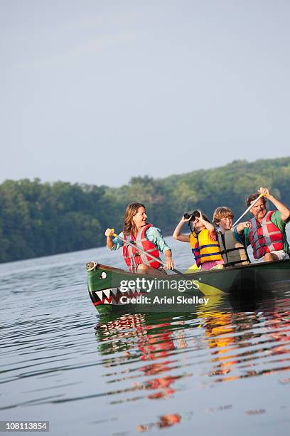 caucasian family canoeing together - life jacket isolated stock pictures, royalty-free photos & images