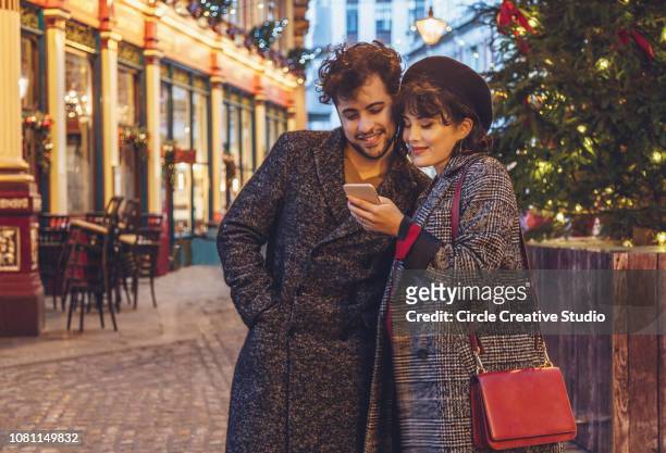 happy couple christmas shopping - convenience stock pictures, royalty-free photos & images