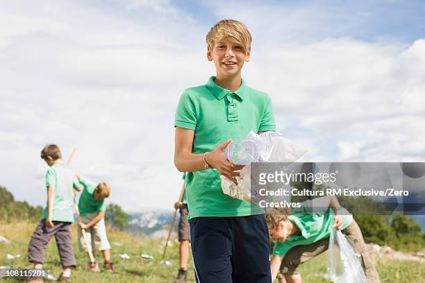 environmental fieldtrip - portrait of school children and female teacher in field stock pictures, royalty-free photos & images