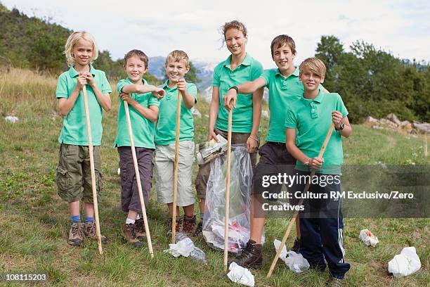 environmental fieldtrip - portrait of school children and female teacher in field stock pictures, royalty-free photos & images