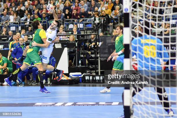 Romain Lagarde of France vies with Jose Toledo of Brazil during the Group A match of 26th IHF Men's World Championship between Brazil and France at...
