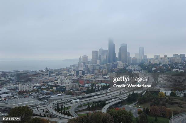 foggy, rainy seattle, skyscrapers, freeways, fall - seattle rain stock pictures, royalty-free photos & images