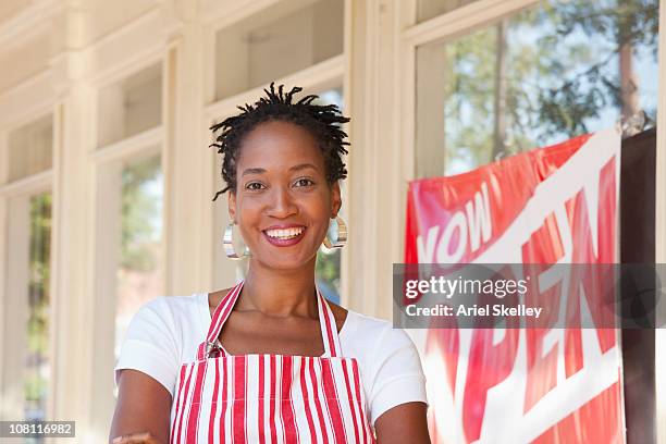 proud african american small business owner - building opening ceremony stock pictures, royalty-free photos & images