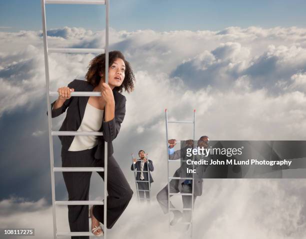 business people climbing ladders into clouds - carrièreladder stockfoto's en -beelden