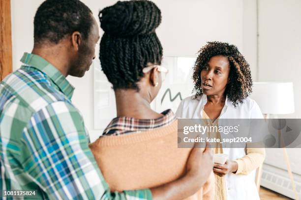 medical consultation - married doctors stock pictures, royalty-free photos & images