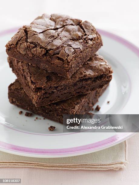 stack of chocolate brownies - brownie stock pictures, royalty-free photos & images