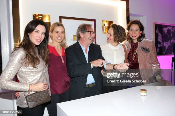 Alexandra Polzin, Annika Blendl, Didier Guillon, founder and CEO Valmont Group and Valmont Foundation shows his Gorilla tattoo at his arm to Lara Joy...