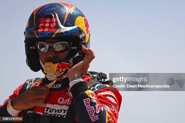 Nasser Al-Attiyah of Qatar with his Toyota Gazoo Racing Sa no. 301 TOYOTA HILUX car and co-driver Matthieu Baumel of France gets ready to start on...