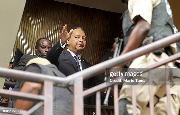 Jean-Claude Duvalier , the former Haitian leader known as 'Baby Doc', is taken into custody by Haitian police at the Hotel Karibe on January 18, 2011...