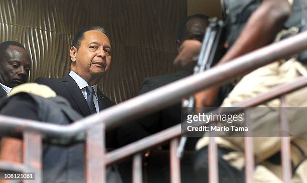 Jean-Claude Duvalier , the former Haitian leader known as 'Baby Doc', is taken into custody by Haitian police at the Hotel Karibe on January 18, 2011...
