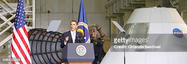In front of a Space Shuttle Engine at left, and the Orion capsule on right, President Barack Obama announces a $40 million multi-agency effort to...