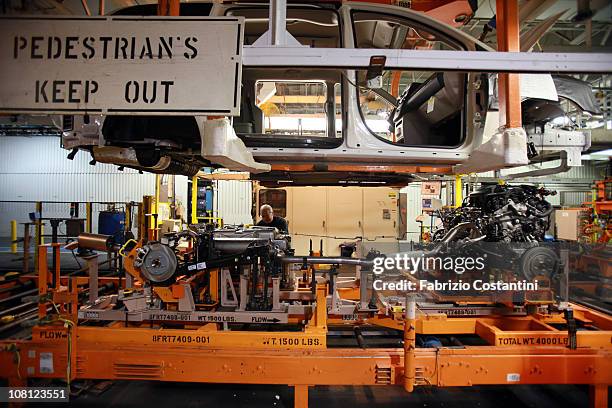 The marriage of chassis and body for a Chrysler Minivan on the assembly line at the Chrysler Windsor Assembly plant January 18, 2011 in Windsor,...