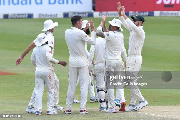Duanne Olivier of the Proteas celebrates the wicket of Babar Azam of Pakistan with his team mates during day 2 of the 3rd Castle Lager Test match...