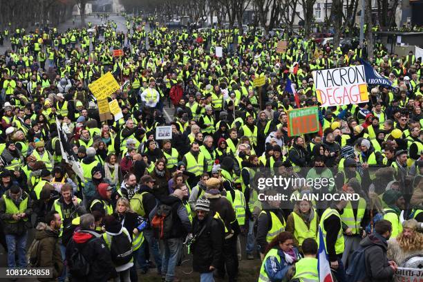 People gather during an anti-government demonstration called by the Yellow Vests "Gilets Jaunes" movement, in Bourges on January 12, 2019. - France...