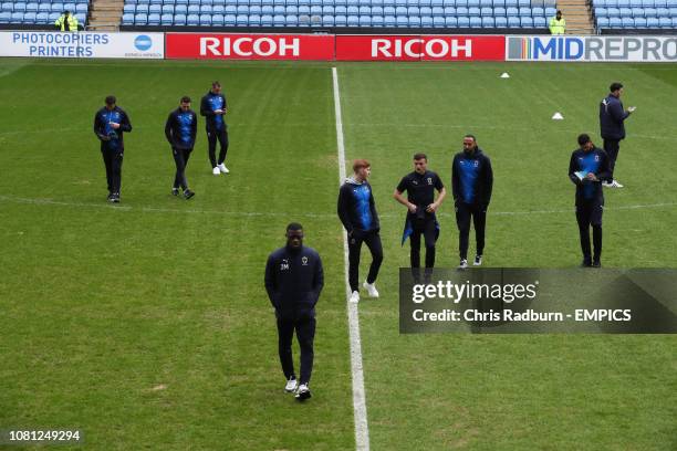 Wimbledon players inspect the pitch after arriving at The Ricoh Arena ahead of their Sky Bet League One match against Coventry City. Coventry City v...