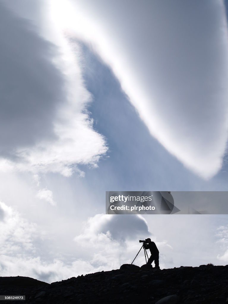 Photographer on ledge