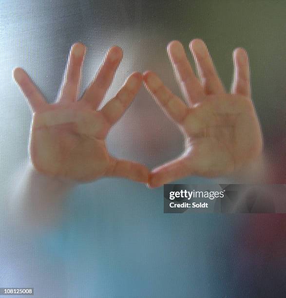 hands reaching out from a blurred image of a child - stuck door stock pictures, royalty-free photos & images