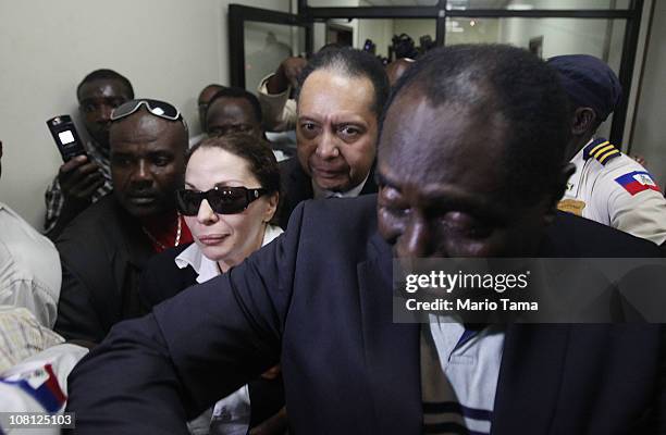 Jean-Claude Duvalier , the former Haitian leader known as 'Baby Doc', departs the courthouse after questioning with his girlfriend Veronique Roy as...