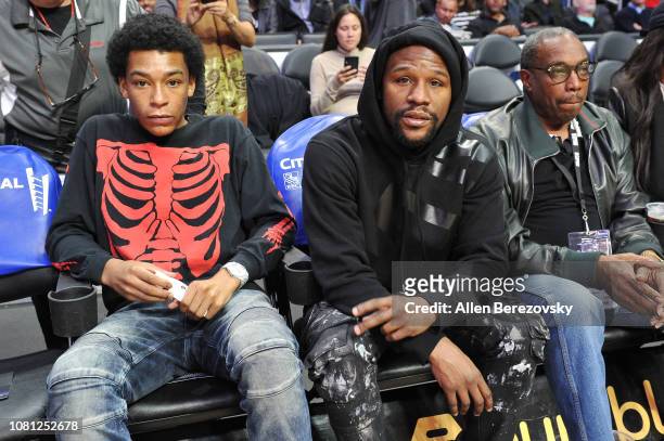 Floyd Mayweather Jr. And Koraun Mayweather attend a basketball game between the Los Angeles Clippers and the Toronto Raptors at Staples Center on...