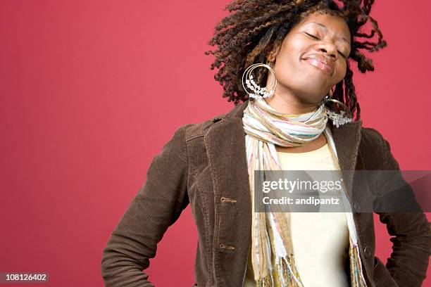 young woman dancing and tossing hair - funky hair studio shot stock pictures, royalty-free photos & images