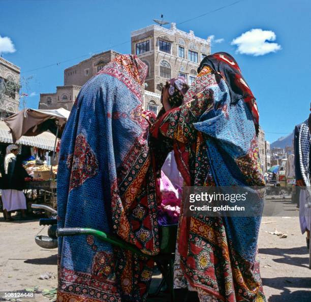 three yemeni woman in traditional veils - yemen stock pictures, royalty-free photos & images